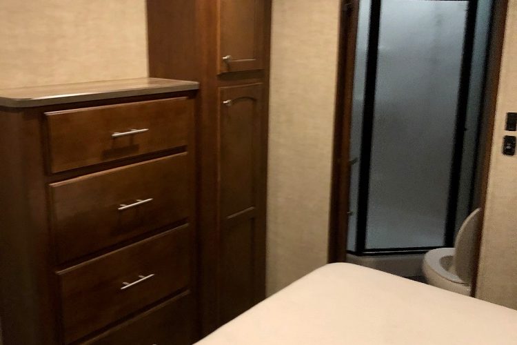 Stand up shower and dresser in bedroom Stand up shower and dresser in bedroom