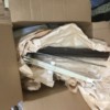 Box full of accessories, parts and pieces Box full of accessories, parts and pieces